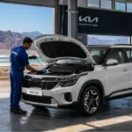 KIA Seltos entretien Djibouti — technicien ACRIES réalisant une révision complète dans l'atelier officiel KIA